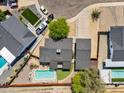 Beautiful home features a pool, patio, lush lawn and well-manicured landscaping, perfect for outdoor living at 10007 N 30Th Pl, Phoenix, AZ 85028