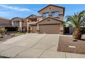 Spacious home with a long driveway leading to a three-car garage and desert landscaping at 10758 E Lobo Ave, Mesa, AZ 85209