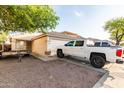 Charming single-story home with a well-maintained front yard and a two-car garage at 11221 W Devonshire Ave, Phoenix, AZ 85037