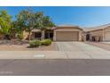 Charming single-story home with a well-kept front yard and a convenient two-car garage at 11341 W Barbara Ave, Peoria, AZ 85345
