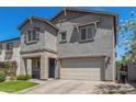 Charming two-story home with stone accents, a well-manicured lawn, and an attached two-car garage at 11526 E Shepperd Ave, Mesa, AZ 85212