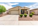 Inviting single-Gathering home with a well-kept lawn and a cozy porch swing, perfect for relaxing outdoors at 12357 W Whyman Ave, Avondale, AZ 85323