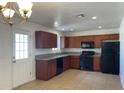 Well-lit kitchen featuring ample cabinet space and modern black appliances at 1532 W 6Th St, Tempe, AZ 85281