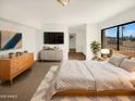 Main bedroom offers a modern aesthetic with bright walls, decor, and large windows at 15650 N 19Th Ave # 1206, Phoenix, AZ 85023