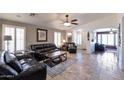 Spacious living room featuring tile floors, neutral paint and comfortable seating at 16461 W Central St, Surprise, AZ 85388