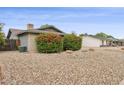 Lovely home with colorful bougainvillea bushes and a drought-tolerant rock landscape at 1649 W Royal Palm Rd, Phoenix, AZ 85021