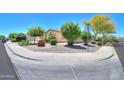 Neighborhood street corner with desert landscaping and a view of the home's exterior at 1761 N Hester Trl, Casa Grande, AZ 85122