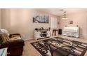 Cozy living room featuring neutral paint, tile floors, and lots of natural light at 17825 W Lincoln St, Goodyear, AZ 85338