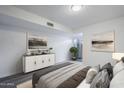 Comfortable bedroom featuring stylish decor, dresser, and soothing color palette at 1847 E Kirkland Ln # C, Tempe, AZ 85281