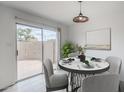 Charming dining area with sliding glass doors to the backyard offers ample natural light at 1847 E Kirkland Ln # C, Tempe, AZ 85281