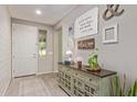 Bright entryway featuring stylish decor, a decorative console table, and a view into the home at 23179 S 225Th Pl, Queen Creek, AZ 85142
