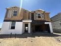 Exterior view of a new two-story home under construction with an open garage at 2351 E Homesteader Rd, San Tan Valley, AZ 85140