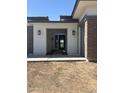 Inviting entryway with stylish lighting fixtures and a modern front door at 24000 S 218Th Pl, Queen Creek, AZ 85142