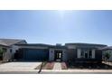 Attractive single-story home boasting modern architectural design, and tasteful landscaping at 24000 S 218Th Pl, Queen Creek, AZ 85142