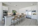 Spacious kitchen with a large center island, stainless steel appliances, and plenty of seating at 24000 S 218Th Pl, Queen Creek, AZ 85142