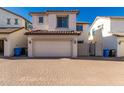 Spacious two-car garage with ample brick paver driveway for extra parking at 26521 N Babbling Brook Dr, Phoenix, AZ 85083