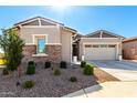 Charming single story home with stone accents and landscaped front yard, perfect for curb appeal at 32582 N Durango Ln, San Tan Valley, AZ 85143