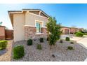 Well-maintained home with desert landscaping and a charming stone facade at 32582 N Durango Ln, San Tan Valley, AZ 85143