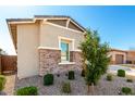 Well-maintained home with desert landscaping and a charming stone facade at 32582 N Durango Ln, San Tan Valley, AZ 85143
