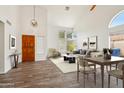 Bright and airy living room with vaulted ceilings and wood-look tile flooring at 4043 N Ranier --, Mesa, AZ 85215