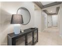 Bright and welcoming hallway with decorative lighting, high ceilings, and stylish furniture at 4141 E Morrison Ranch Pkwy, Gilbert, AZ 85296