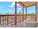 Inviting balcony with comfortable seating and a view of the neighborhood at 4408 W Heyerdahl Dr, New River, AZ 85087