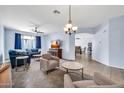 Spacious living room with plush seating, carpet and open layout to dining area at 4408 W Heyerdahl Dr, New River, AZ 85087