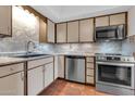 Well-lit kitchen with stainless steel appliances and beautiful, decorative tile backsplash at 515 S Parkcrest -- # 531, Mesa, AZ 85206