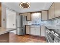 Bright kitchen showcasing stainless steel appliances, tiled floor, and ample counter space at 515 S Parkcrest -- # 531, Mesa, AZ 85206