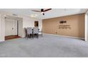Carpeted living room with dining area and accent wall at 515 S Parkcrest -- # 531, Mesa, AZ 85206