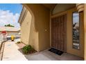 View of covered front door, featuring security door, and a 'Bless This Home' welcome mat at 5830 E Mckellips Rd # 101, Mesa, AZ 85215