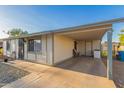Large covered patio with neutral paint and concrete flooring at 6960 W Berkeley Rd, Phoenix, AZ 85035