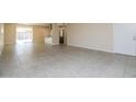 Spacious living room with tile floors that flows to the adjacent kitchen at 8227 E Heatherbrae Dr, Scottsdale, AZ 85251