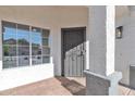 Covered front porch with a decorative security door and a view of the window and column details at 1071 N Danyell Dr, Chandler, AZ 85225