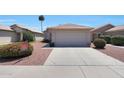 Charming single-story home with desert landscaping and a two-car garage at 11207 W Turney Ave, Phoenix, AZ 85037