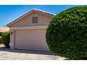 Close up of garage on single Gathering home at 13439 W Desert Ln, Surprise, AZ 85374