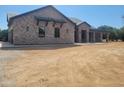 Charming single-story home with brick accents and a spacious yard at 18035 E San Tan Blvd, Queen Creek, AZ 85142