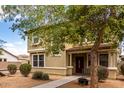 Charming two-story home with a covered porch and lush landscaping at 1835 S Rockwell St, Gilbert, AZ 85295