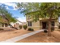 Inviting two-story home with a well-maintained front yard and mature trees at 1835 S Rockwell St, Gilbert, AZ 85295