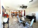Open dining room with a view of the kitchen, showcasing seamless flow and a modern design at 18427 E Verde Ct, Gold Canyon, AZ 85118