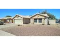 Well-maintained home with desert landscaping, a private drive and an attached garage at 19808 N 3Rd Ave, Phoenix, AZ 85027
