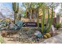 A welcoming community sign surrounded by desert landscaping including cacti and succulents at 20750 N 87Th St # 1065, Scottsdale, AZ 85255