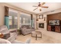 Comfortable living room featuring a fireplace, neutral decor, and ample natural light at 20750 N 87Th St # 1065, Scottsdale, AZ 85255