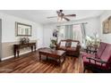 Inviting living room with wood flooring, traditional furnishings, and a neutral color palette at 2419 E Billings St, Mesa, AZ 85213
