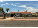 Charming single-story home with a manicured front yard and secure chain-link fencing at 2928 N 37Th Ave, Phoenix, AZ 85019