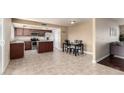 Inviting kitchen and dining area featuring stainless steel appliances and a stylish dining table at 3415 E Anderson Dr, Phoenix, AZ 85032