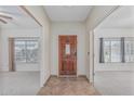 Inviting entryway featuring tile floors and clear views of adjacent rooms and windows at 4207 W Soft Wind Dr, Glendale, AZ 85310
