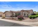 Inviting single-story home showcasing desert landscaping, solar panels and a neutral-toned exterior at 4234 E Narrowleaf Dr, Gilbert, AZ 85298
