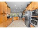 Spacious kitchen with stainless steel appliances, wooden cabinets, and ample counter space at 4234 E Narrowleaf Dr, Gilbert, AZ 85298