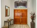 Welcoming front entry featuring a stylish chandelier, mirror and decor at 4762 E White Aster St, Phoenix, AZ 85044
